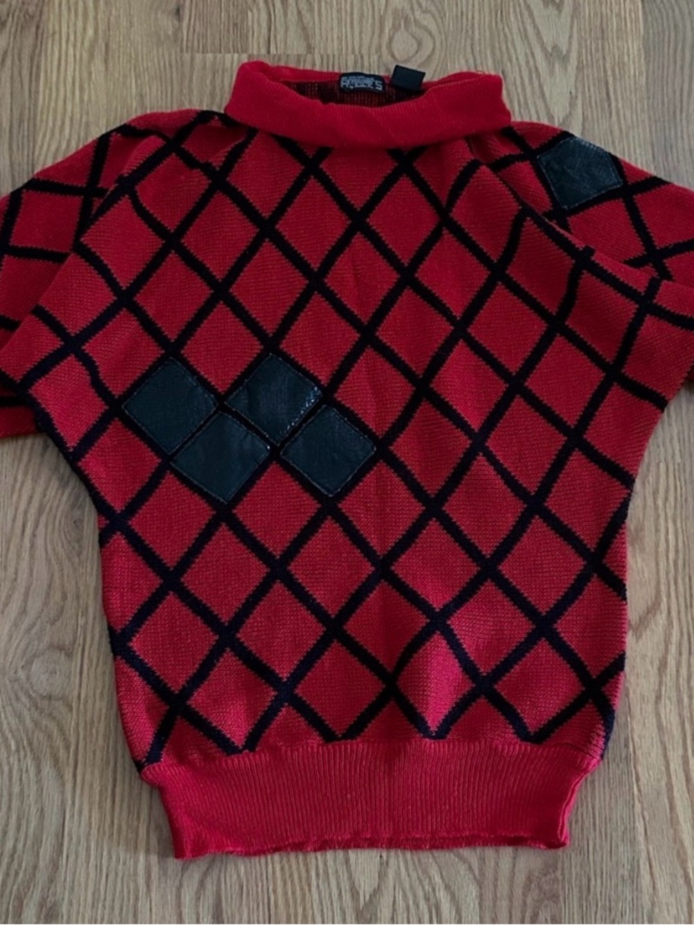 Vintage 1980s or 1990s statement sweater by the brand Answers by Riddler, Inc.